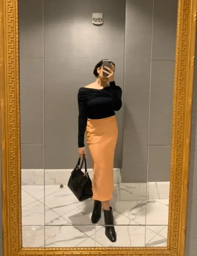 woman in midi skirt outfit for petite capsule wardrobe