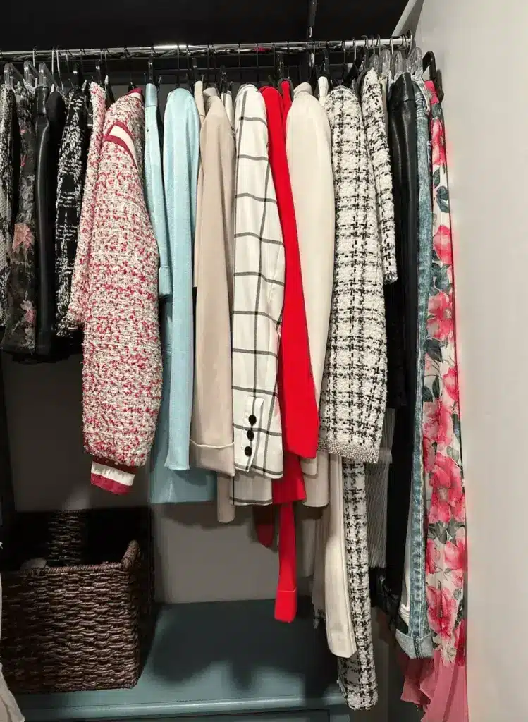 clothes hanging neatly in closet