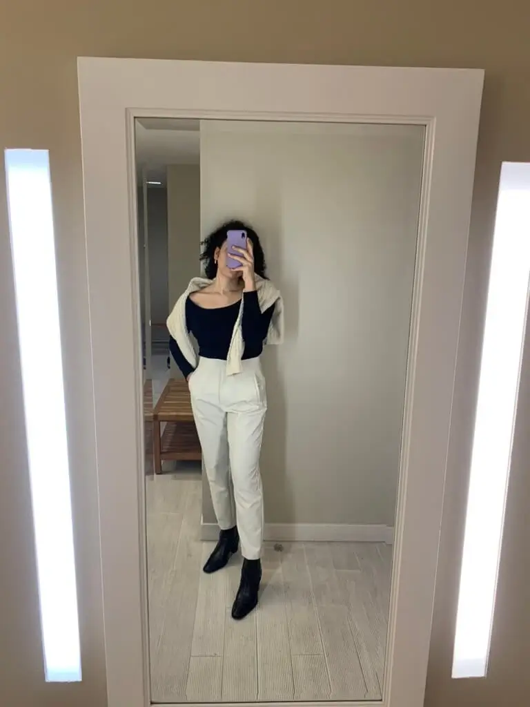 cream trousers and boots winter capsule outfit