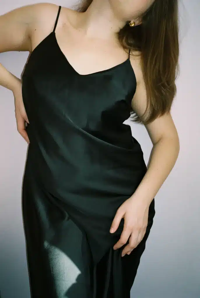 woman with plus size hourglass body shape wearing black dress