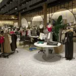 aritzia store entrance featuring mannequins in minimalist clothing