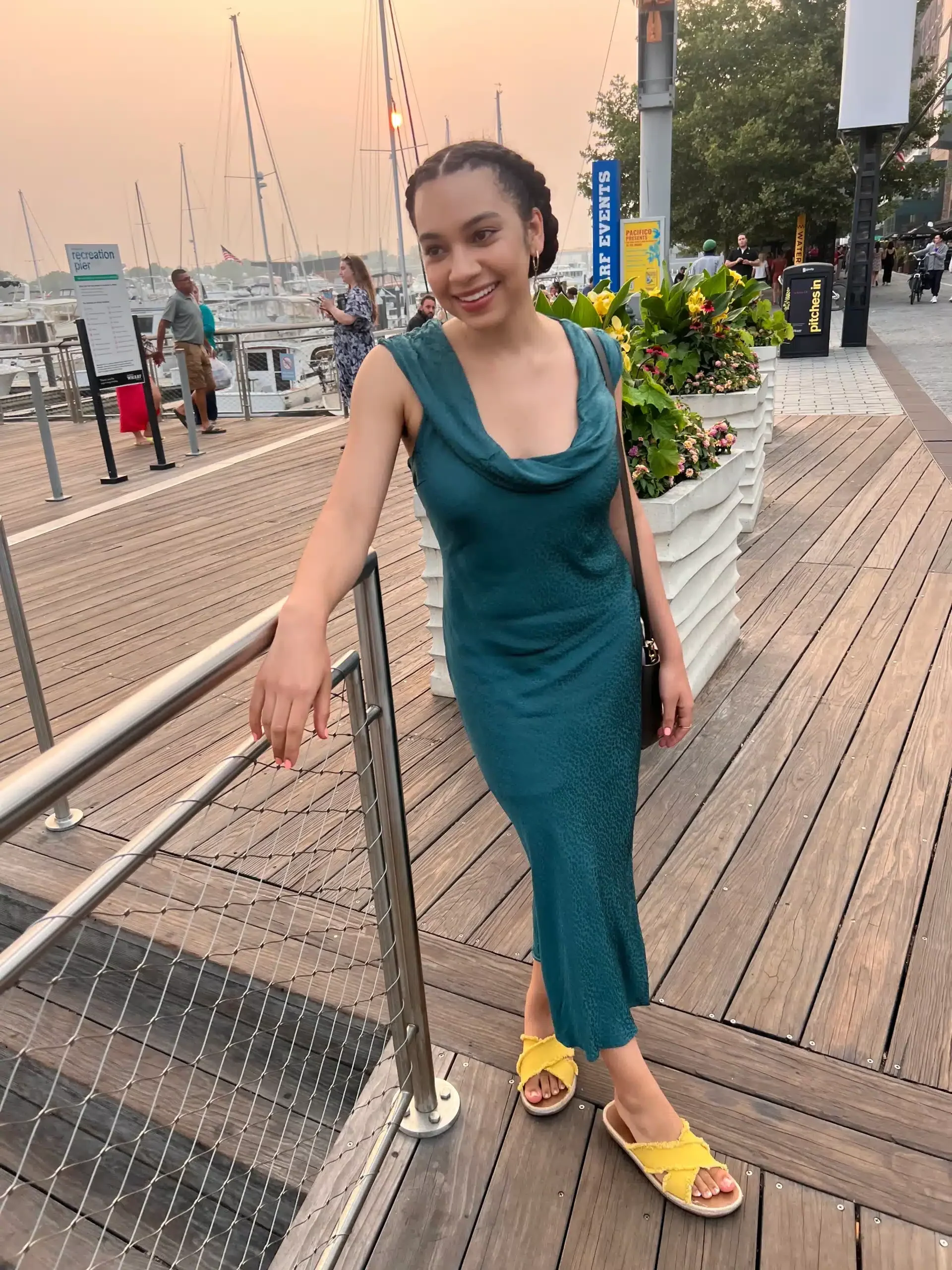 petite woman in silky blue midi dress