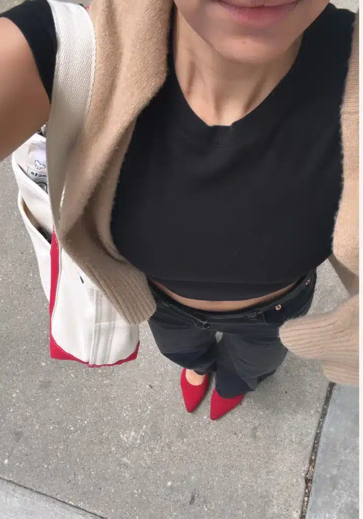 woman in monochrome outfit and red VIVAIA ballet flats 