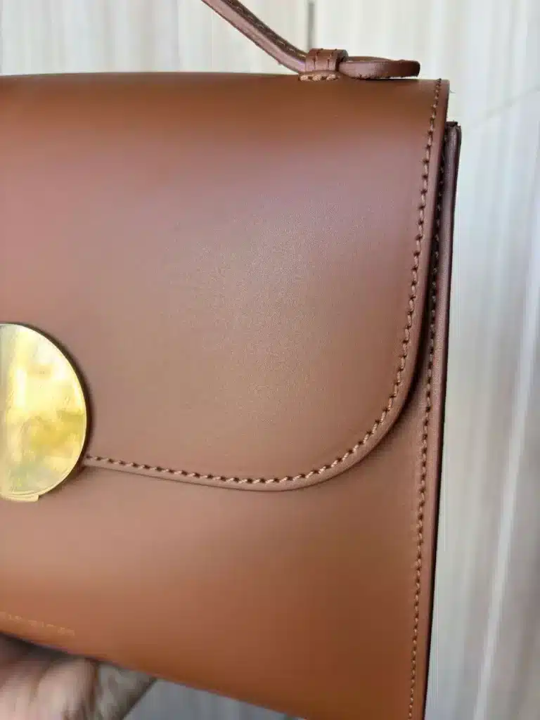 Italian leather cognac colored handbag close up