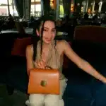 Woman with LeParmentier bag in hotel lobby