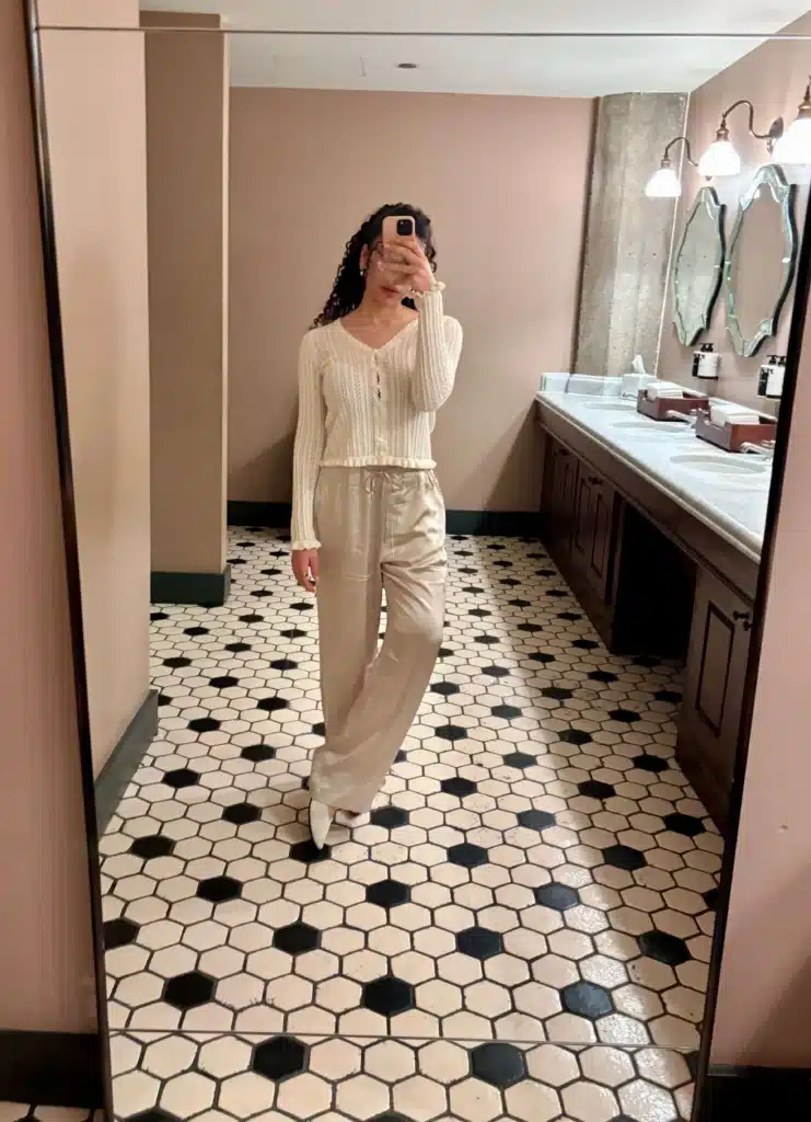 Woman in cream cardigan and Silk Wide Leg Pants for summer capsule wardrobe