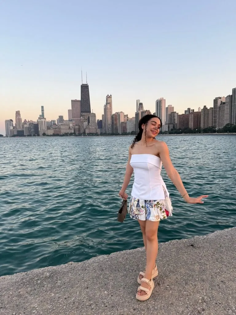 woman in white strapless top and floral mini skirt summer capsule wardrobe items