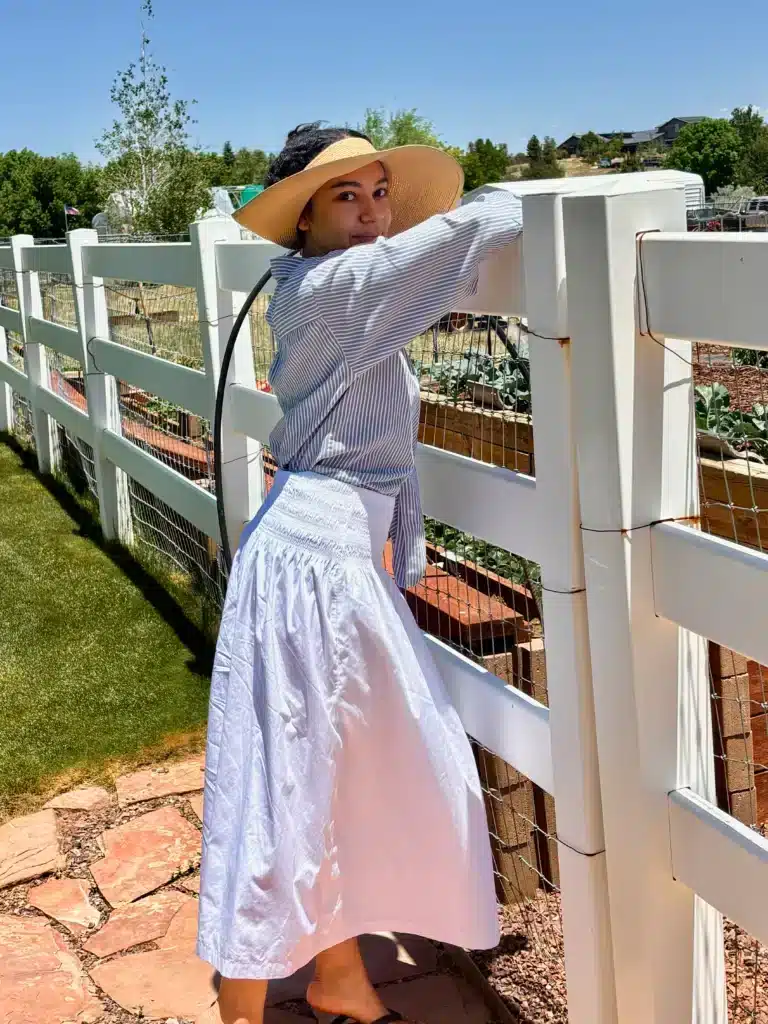 woman in white skirt and sunhat