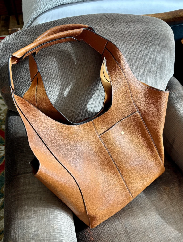 RSVP PARIS Parachute bag in cognac on hotel chair