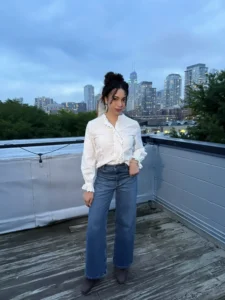 Woman on rooftop wearing natural fiber cotton blouse