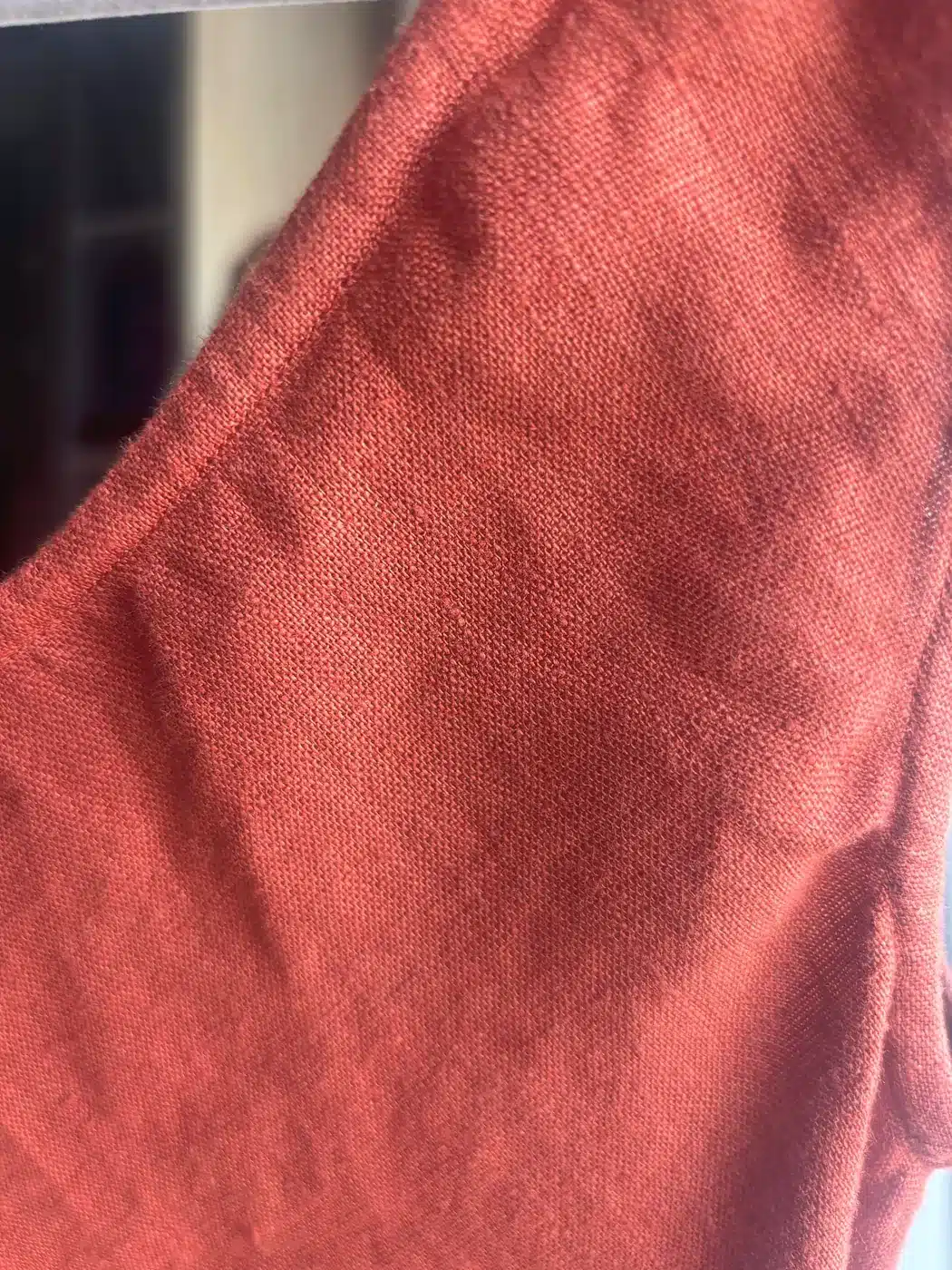 Close-up of the weave on a rust handmade European linen dress
