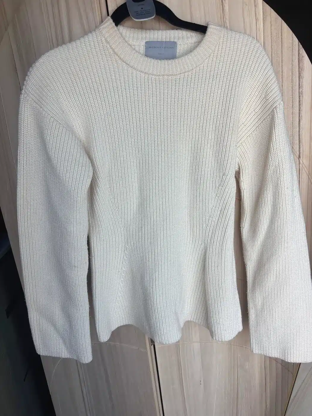Cream Modern Citizen rib-knit sweater with shaped seams on a hanger