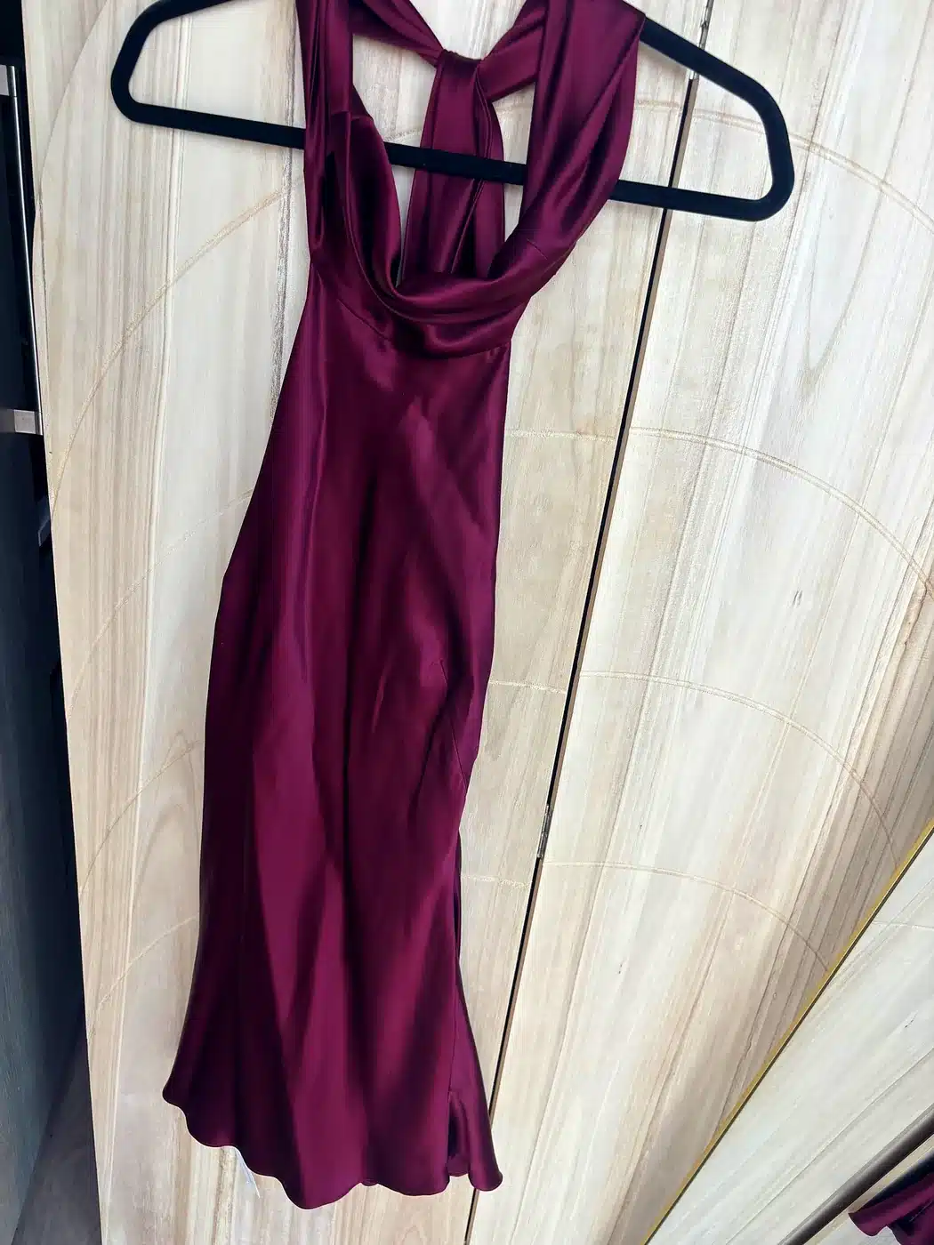 Wine Reformation Helen silk halter dress on a hanger